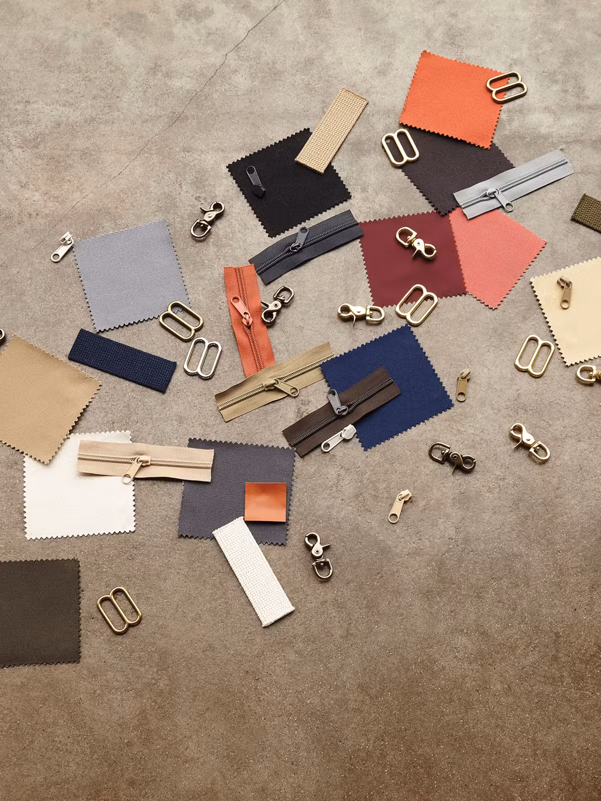 Custom design elements like fabric swatches and zippers. 