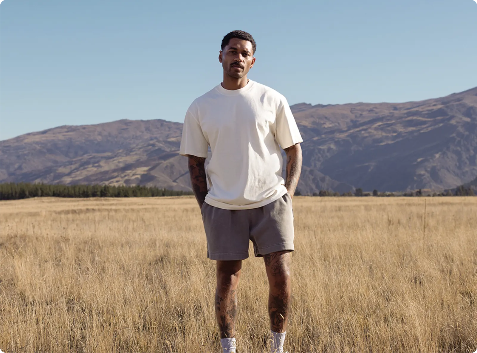 Person wearing thoughtfully sourced branded apparel outdoors