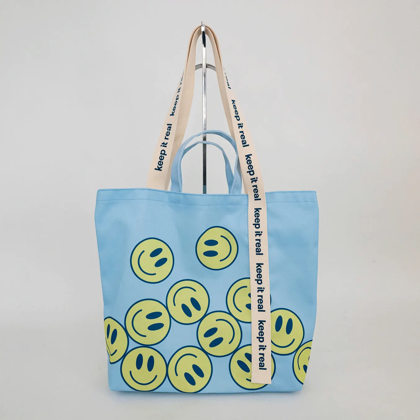 A custom tote bag with modern pattern and custom silkscreen handle. 